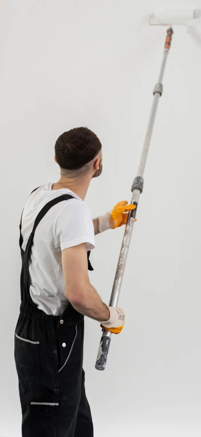 Professional painter holding a paint roller representing Best Painting LA contact and estimate services in Los Angeles, CA